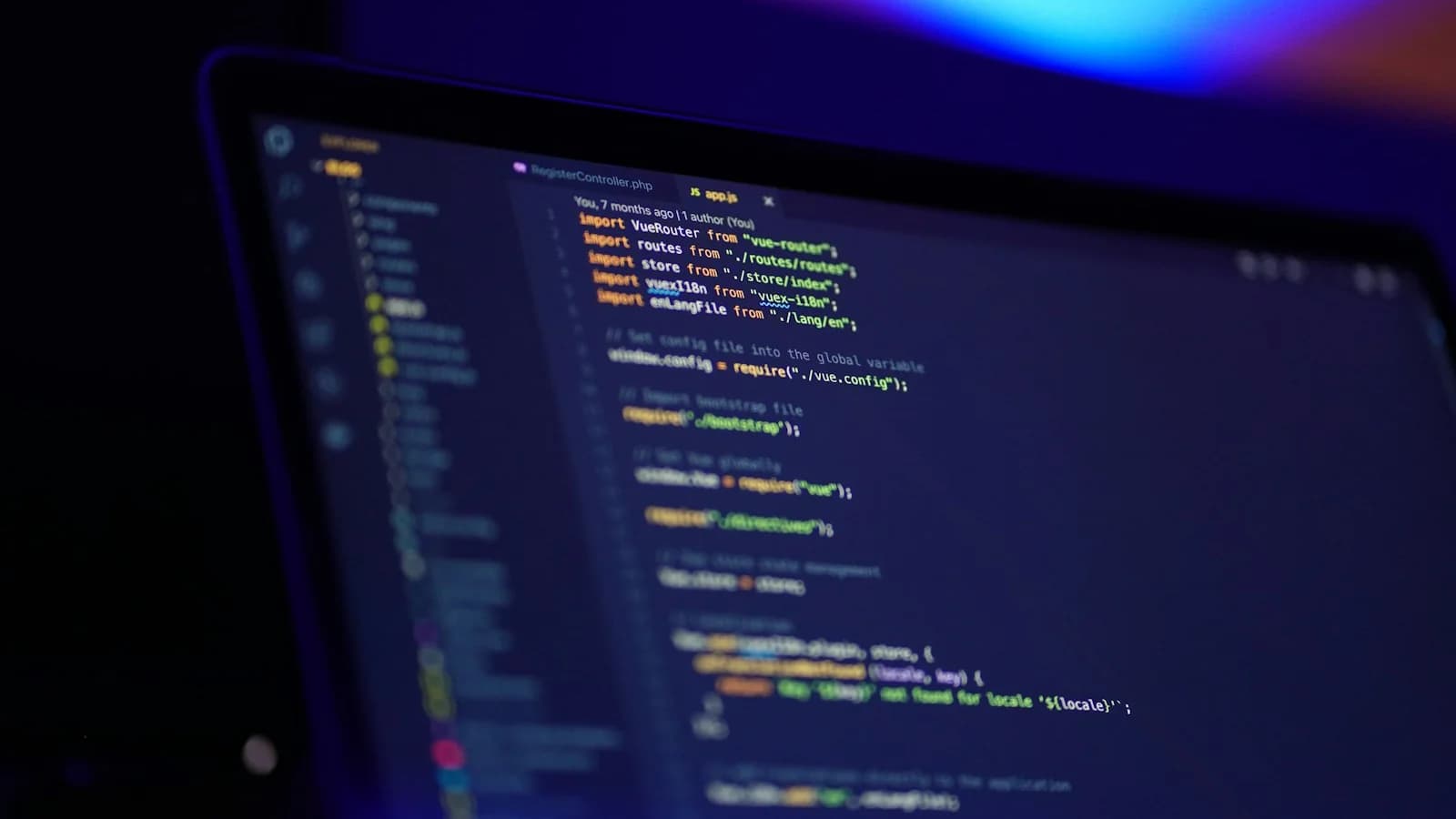 Developer workstation displaying JavaScript application code, secure execution boundaries, and terminal monitoring